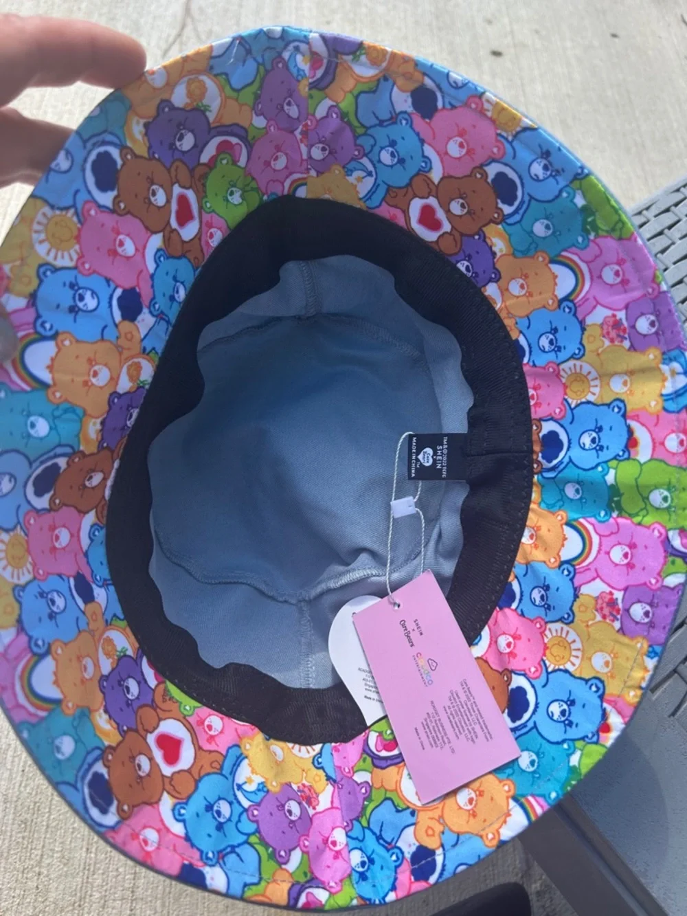 SHEIN Blue Reversible Bucket Hat with Pearl Trim and Rainbow Care Bear Patch - Picture 4 of 4